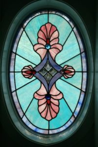 Custom oval shaped stained glass window