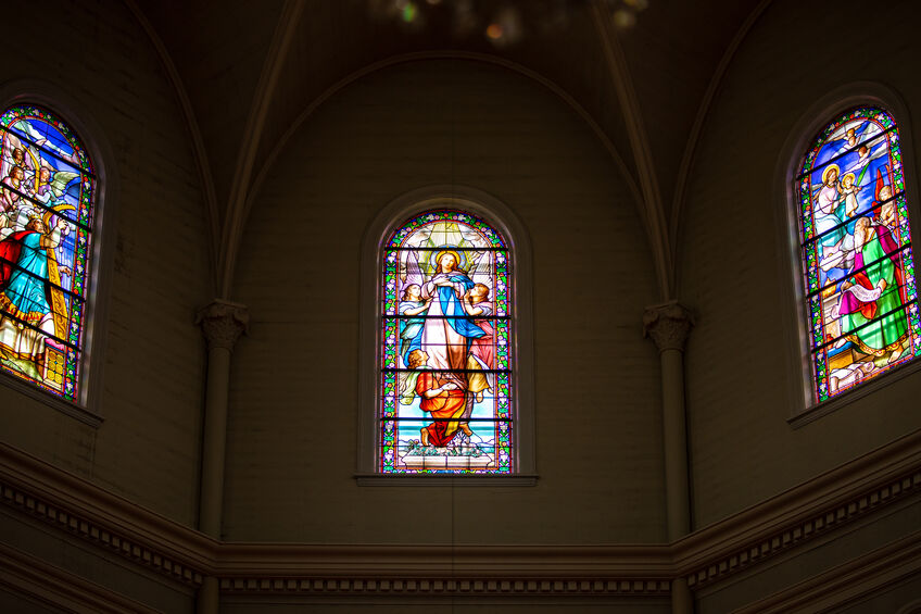 Three stained glass panes in a church