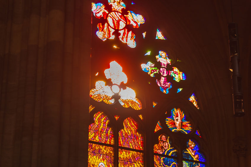 Stained Glass in a Church With the Sun Shining Through