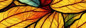 stained glass of leaves in autumn colors such as yellow, red, sage green, and orange.