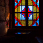 stained glass window with reflection of colored rays of the sun