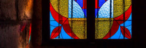 stained glass window with reflection of colored rays of the sun
