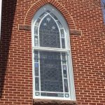 Custom shaped protective stained glass window coverings