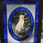 A stained glass panel with the portrait of family's dog