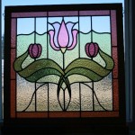 A stained glass panel with flower