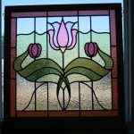A stained glass panel with flower