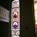 After restoring a tall stained glass window