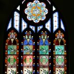 A restoration of a large, complex stained glass window